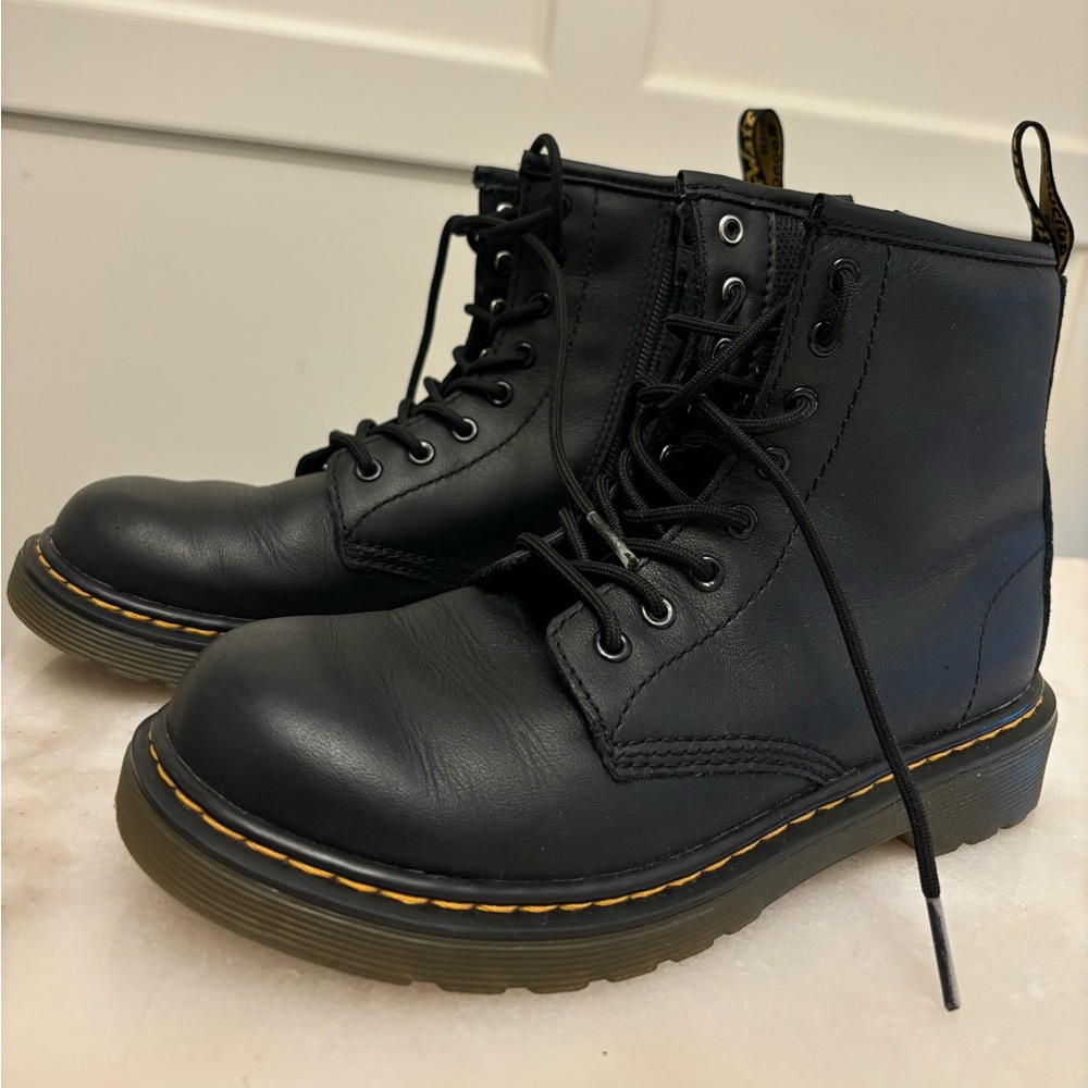 Black leather lace up Dr. Martens boots. Kids size 3.